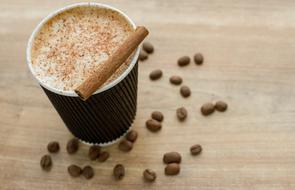 coffee in cup with cinnamon and Beans