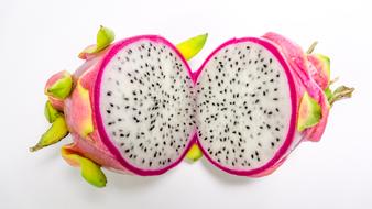 Dragon fruit cut in half at White background