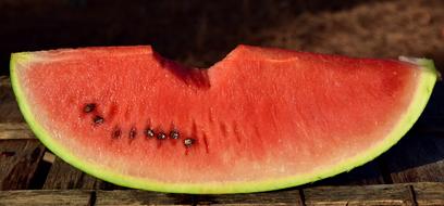 juicy slice of watermelon with seeds close-up