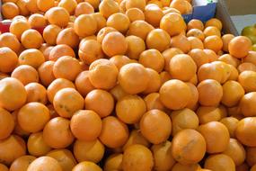 bunch of oranges in the market for sale