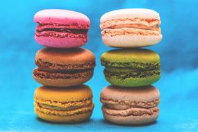 multi-colored macaroons on a blue background