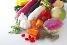 multi-colored vegetables on a white table in the kitchen
