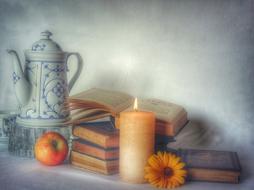 Still Life with old books and candle