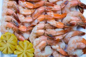 Shrimp with lemon on tray