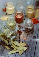 jars of spices on a wooden table