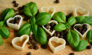 pastra in the shape of a heart, basil and peppercorns