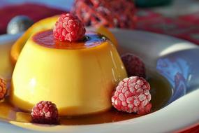 Flan, caramel pudding with raspberry, macro