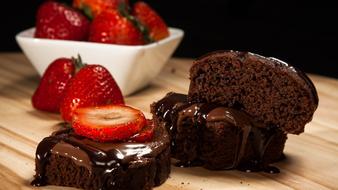 sweet chocolate brownies and strawberries on the table