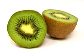 two halves of kiwi on a white background