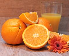 Orange juice and Fruits on table