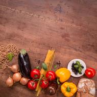 ingredients for italian cuisine on a wooden surface