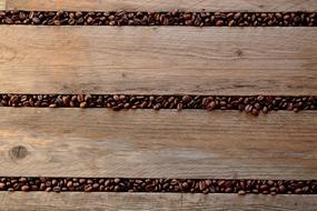 coffee beans are sprinkled between the boards