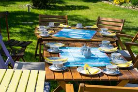 set tables in the garden for a party