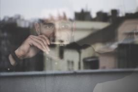man portrait in window