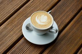 aromatic coffee with foam in a cup