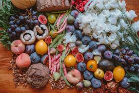 Colorful fruits, vegetables and bread on the table