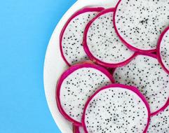 sliced dragon fruit on a white plate