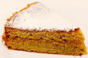 photo of a piece of carrot cake with icing sugar