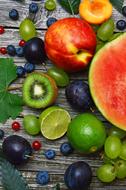 variety of fruits on a wooden surface