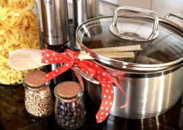 pasta, casserole, wooden spoons and spices in the kitchen