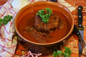 beef stew in a clay plate