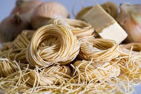 uncooked Pasta and raw onion