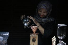 woman brewing coffee