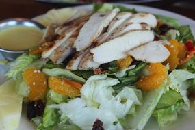 salad with chicken, vegetables and tangerines