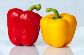 red and yellow bell peppers side by side