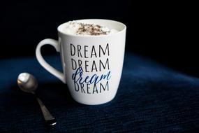 Colorful cup of coffee with Dream word on it
