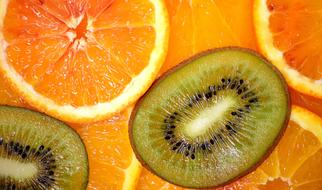 Closeup picture of perfect Delicious Orange and Kiwi fruits