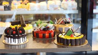 variety of cakes on display in the store