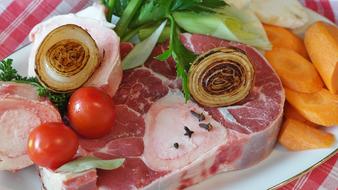 uncooked beef with fresh vegetables