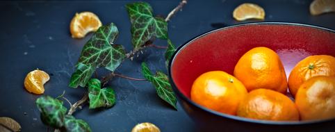 Ivy and Oranges in a bowl