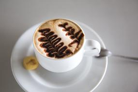 floral Coffee Art in white cup