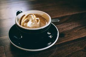 coffee with ice cream in a black cup