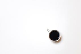Cup with coffee at White background
