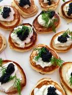 pancakes with black caviar and dill