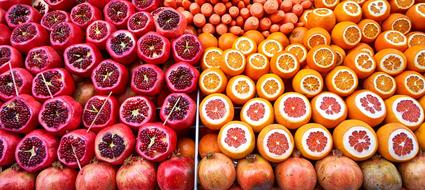 chopped oranges, grapefruits and pomegranates in the market