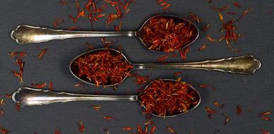 red dried saffron on a spoon