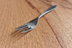 Fork on wooden surface