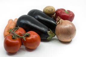 Colorful fresh vegetables on the white surface