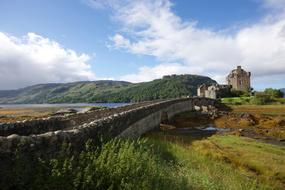 ancient castle with bridge among the colorful nature