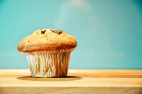 muffin on wooden table close up