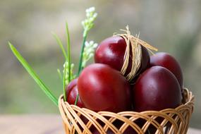 burgundy Easter eggs in a wicker basket