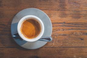 cup of hot espresso on a wooden table