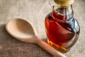 Maple Syrup and wood spoon