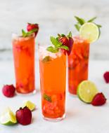 homemade cocktail with strawberries and lemon