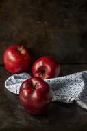 three red Apples and cloth, still life