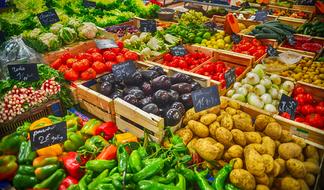 colorful vegetables in wooden boxes at the market
